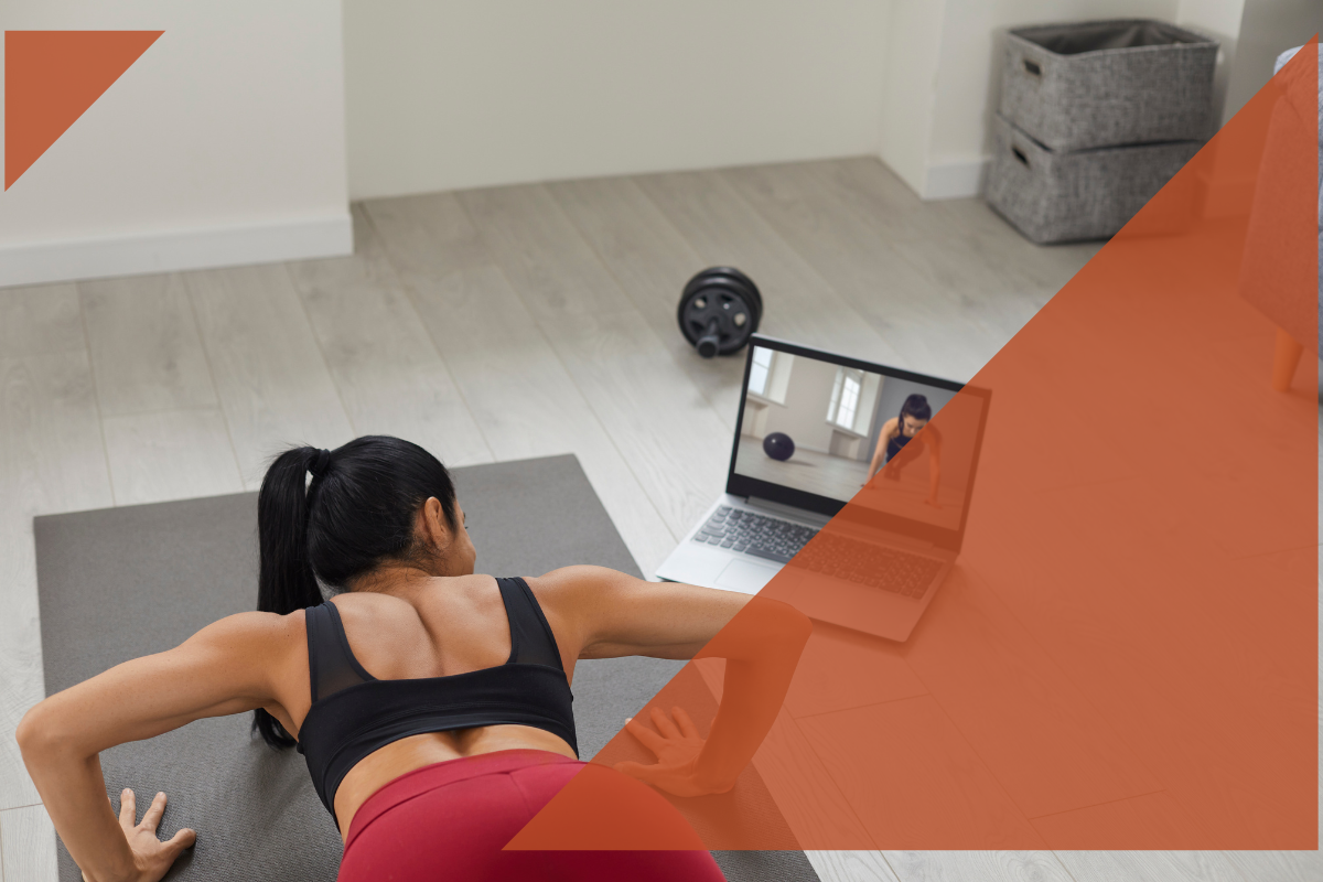 Woman working out at home with computer